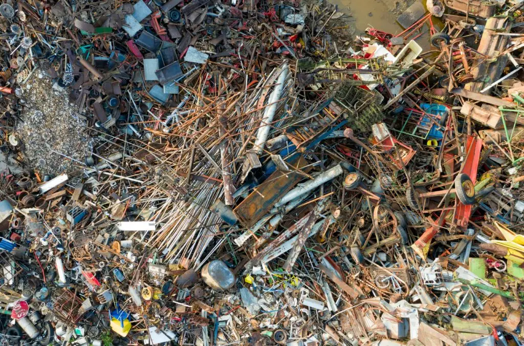 Aerial shot of scrap metal and waste gathered in a junkyard for recycling purposes.